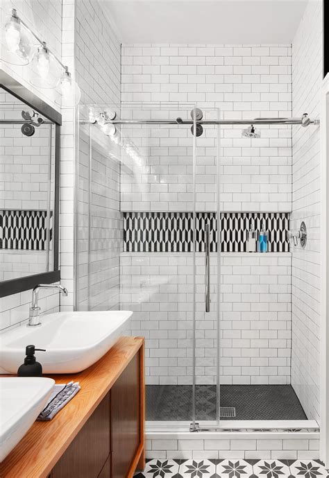 A century later, these simple, cheap, durable laying the tiles in a vertical pattern creates a modern spin on the classic look and draws the eye upward. Modern Industrial Bathroom in 2020 | Subway tiles bathroom ...