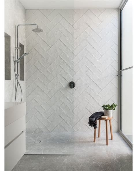 The Textured White Subway Tiles Laid Herringbone By Prolaytiling
