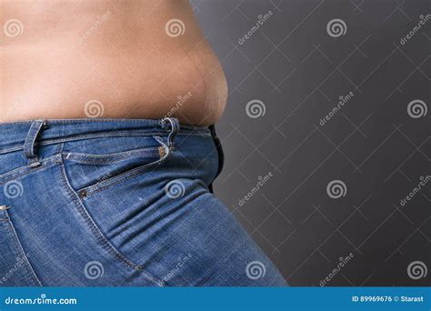Woman With Fat Abdomen In Blue Jeans Overweight Female Stomach