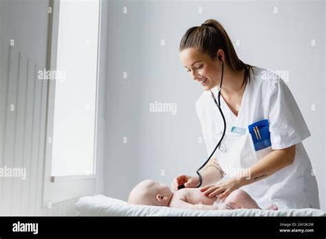 Doctor Examining Baby Stock Photo Alamy