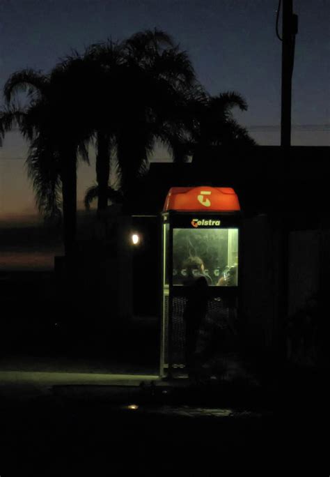 Girl Inside Phone Booth At Dusk Photograph By Alan Poon