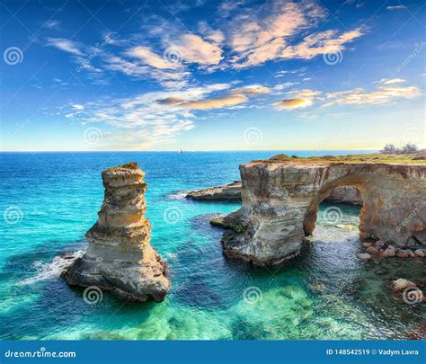 Picturesque Seascape With Cliffs Rocky Arch At Torre Sant Andrea Stock