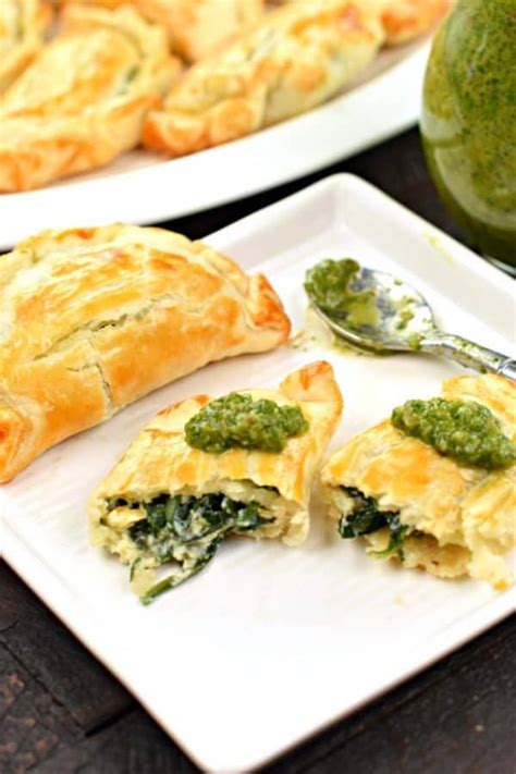Here's my all time favorite pie crust recipe! Flaky pie crust filled with fresh spinach, garlic, and ricotta cheese. These Spinach and Cheese ...