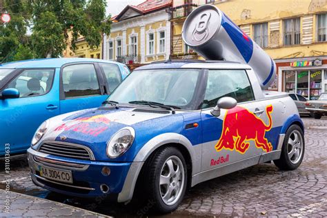 Red Bull Mini Cooper Publicity Car With A Can Of Energy Drink Behind