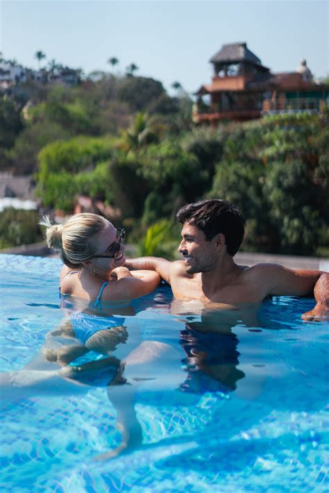 Woman In Blue Bikini Top Kissing Man In Pool · Free Stock Photo