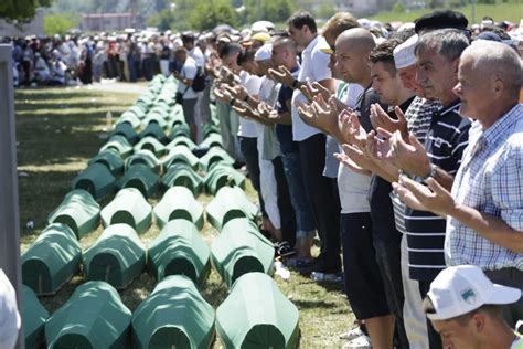 Relatives of victims of the srebrenica genocide weep as they hear news on the decision of the un appeals judges on former bosnian serb leader radovan karadzic in potocari, bosnia and. In Bosnia, Thousands Mark 22 Years Since Srebrenica ...