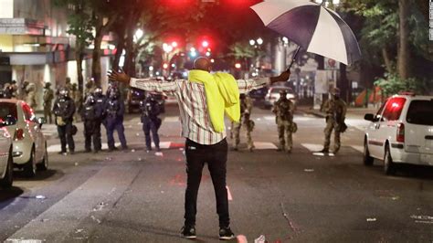 Maybe you would like to learn more about one of these? AMPHIKTYON.BLOGSPOT.COM: Shocking scenes in America A demonstrators stands in front of federal ...