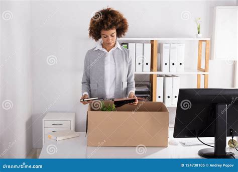 businesswoman packing her belongings in cardboard box stock image image of jobless