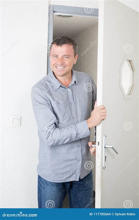 Young Businessman Entering The Door In Office Stock Photo Image Of