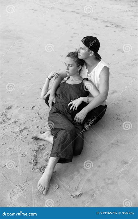 a couple in love embrace on the beach during vacation there is love between the people stock