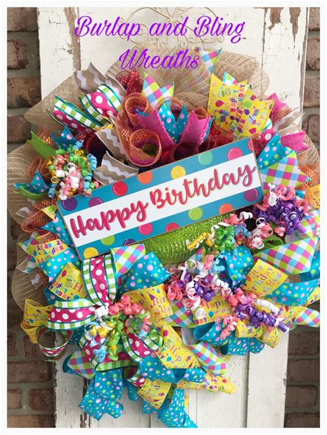 A Colorful Wreath With The Words Happy Birthday Written On It And Ribbons Attached To It