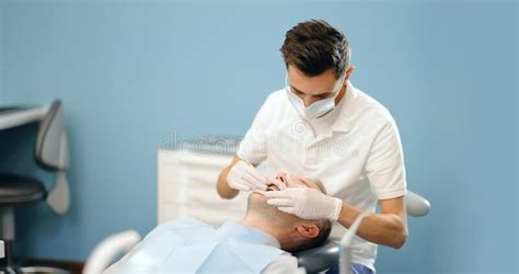 Dentist And Patient During An Orthodontic Treatment Stock Photo Image