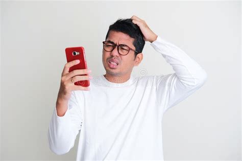 Confused Man Scratching Hair Mobile Phone Stock Photos Free And Royalty