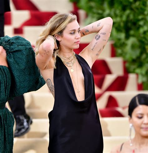 A Guide To Miley Cyruss Most Meaningful Tattoos Popsugar Beauty