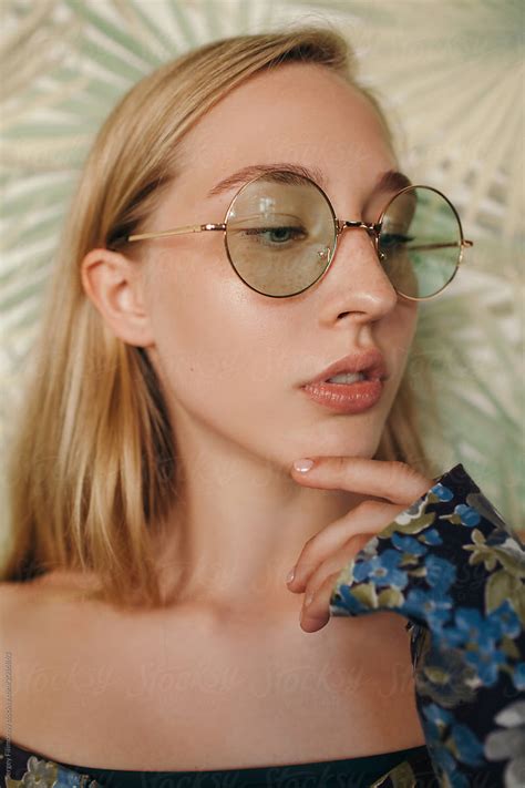 Young Woman In Glasses Looking Away By Stocksy Contributor Sergey Filimonov Stocksy