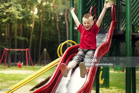Active Boy Sliding Down Stock Photo Download Image Now Slide Play