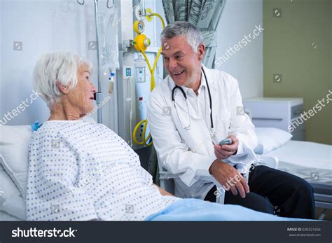 Doctor Interacting Senior Patient Ward Hospital Stock Photo 630321656