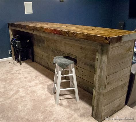 On going through the junk in my basement, i got annoyed at all the cardboard boxes in bad shape holding. Man Cave Wood Pallet Bar {Free DIY Plans}