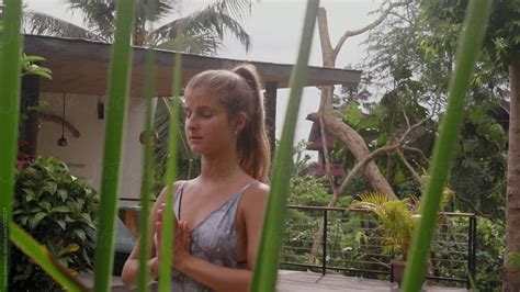 Woman Practising Yoga Next To The Swimming Pool Del Colaborador De