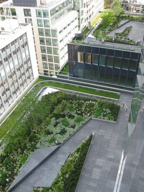 An Aerial View Of Buildings With Green Roofs And Plants Growing On The