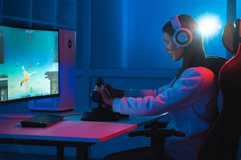 Premium Photo The Gamer Girl With Headphones Playing Video Games