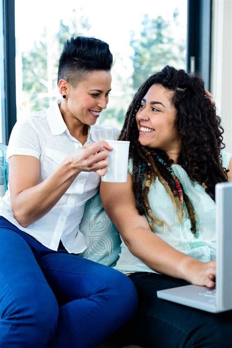 Happy Lesbian Couple Having Coffee And Using Laptop Stock Image Image Of Enjoyment Hair 66973007