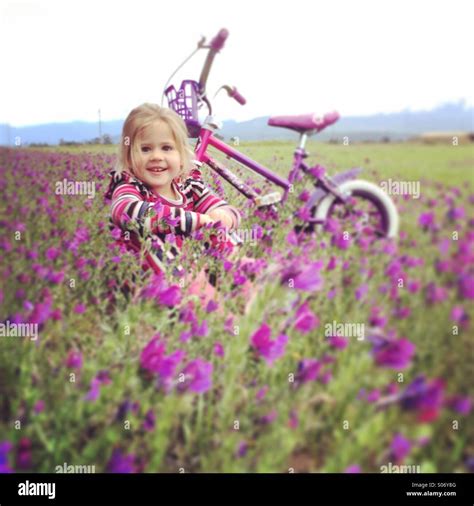 Young Girl In Flowery Field Stock Photo Alamy