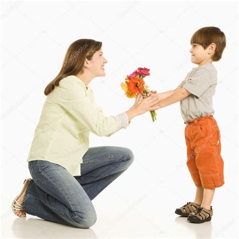 Boy Giving Mother Flowers — Stock Photo © Iofoto 9249387