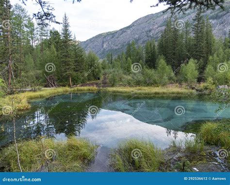 Amazing Blue Geyser Lake In The Mountains Of Altai Russia Stock Photo