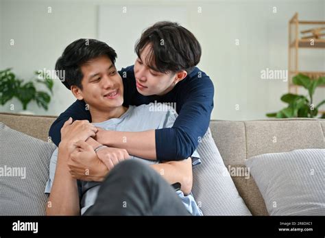 A Happy And Carefree Young Asian Male Gay Couple Hugging Each Other