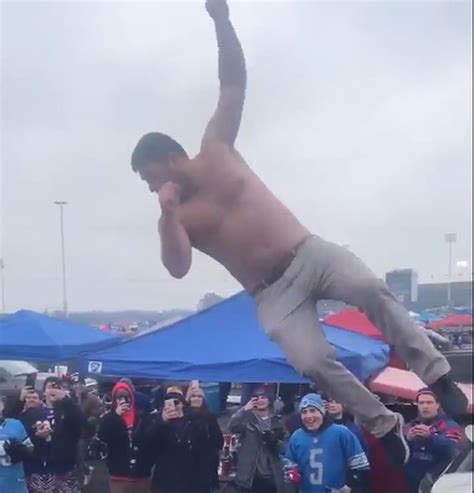 Watch A Bills Fan Jump Through A Table Before Lions Game Mlive Com