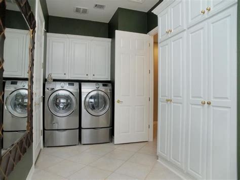 An extract rate of no less than 108m3/h 30 l/sec. Fabulous utility room with plenty of storage cabinets. oh ...