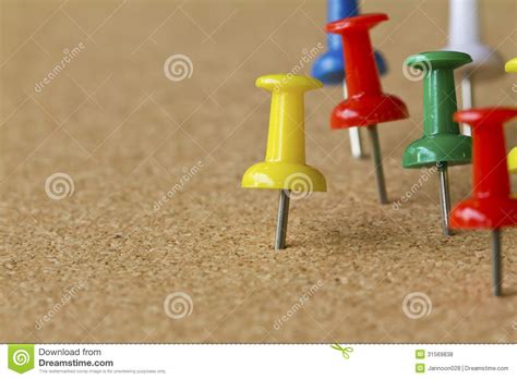 Colorful Push Pins On Cork Bulletin Board Royalty Free Stock Photos