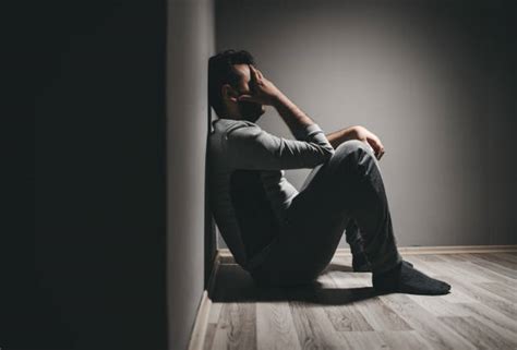 240 Young Depressed Man Sitting In A Corner Stock Photos Pictures