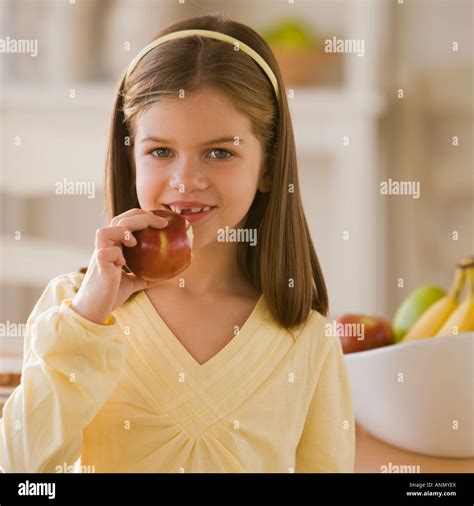 Girl Eating Apple Stock Photo Alamy