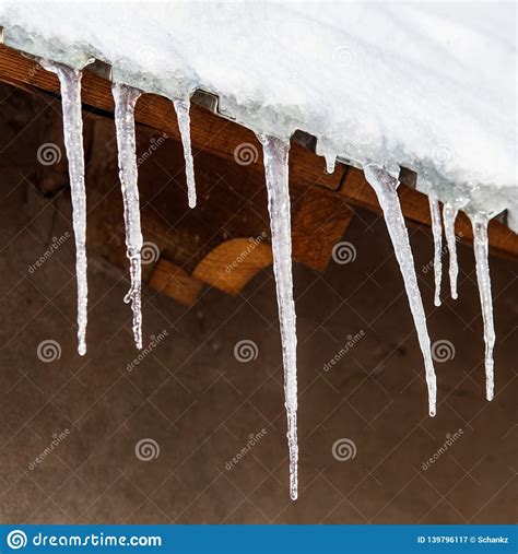 Icicles Hang From The Roof In Winter Stock Image Image Of Clear