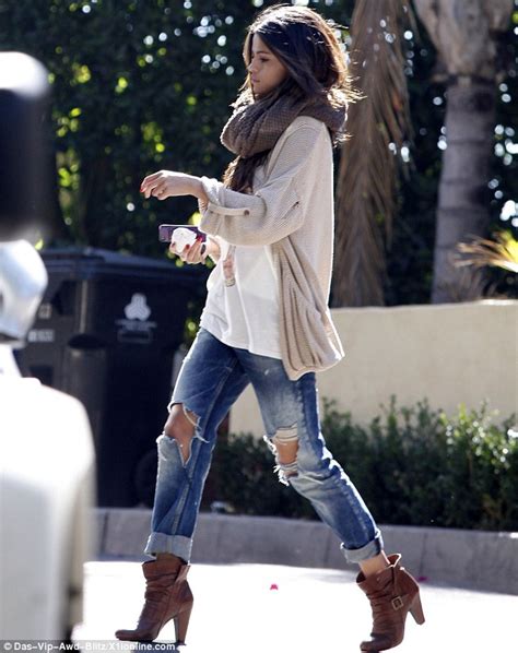 Selena Gomez Recycles The Same Scarf And Boots As She Visits A Friend