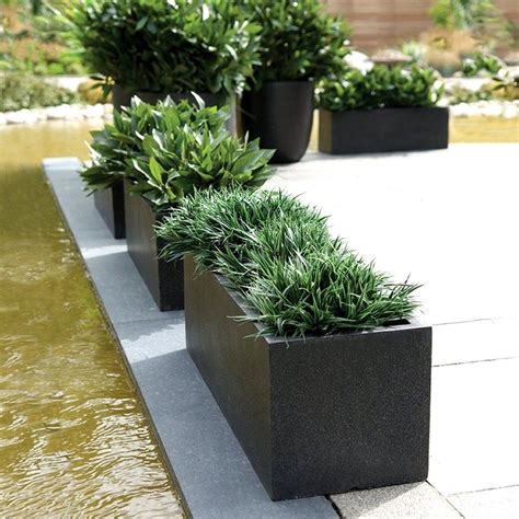 Large ceramic outdoor planters are a wonderful way to accent your flower garden. Cadix Black Low Rectangular Planters | Modern Planters ...