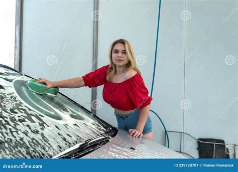 Beautiful Woman Washes Car With Green Sponge In Foam From Dirty Stock