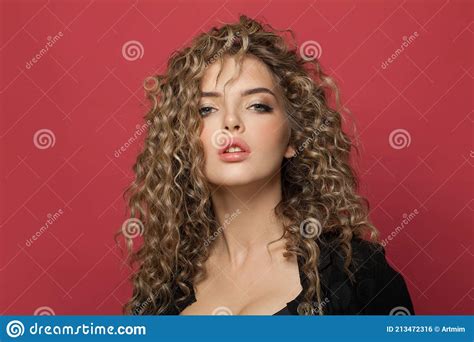 Sensual Woman With Long Curly Hair On Red Background Pretty Model With Trendy Styling Hair Dye