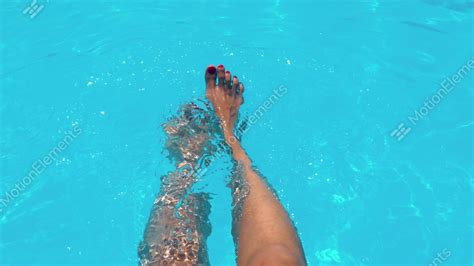 Beautiful Girl Relaxing Her Feet In Pool Water In Summer Stock Video Footage