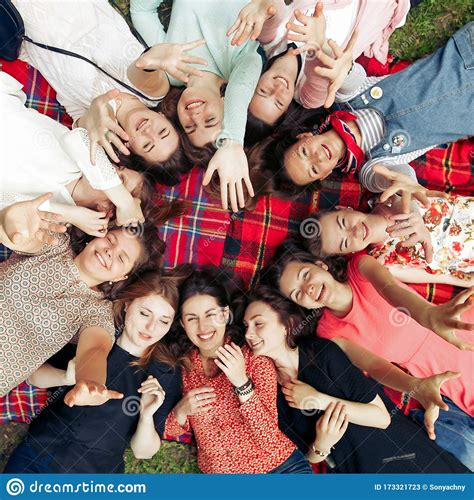 Happy Group Of Women Faces In Circle Laughing And Having Fun On Picnic