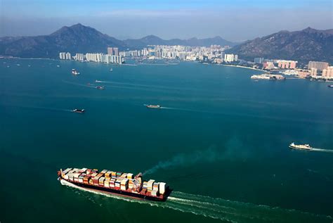 Cargo Ships Entering One Of Busiest Ports In The World Stock Photo