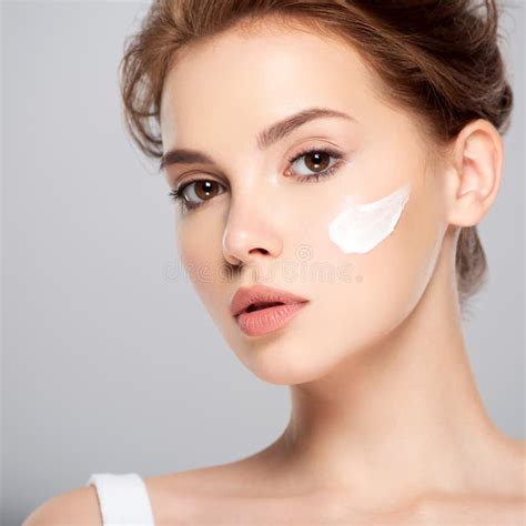 Spot Of Cosmetic Cream On A Woman`s Face Beautiful Face Of Young Caucasian Woman With Perfect