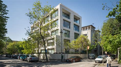 Stone Clad Apartment Building In Bucharest Features Recessed Windows
