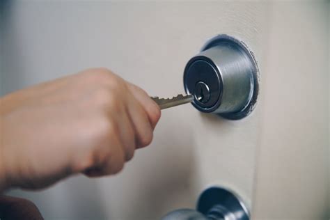 High Res Key In Hand Unlocking Door Picture — Free Images