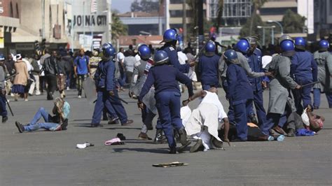 Protesters Clash With Riot Police In Zimbabwe Capital Harare Itv News