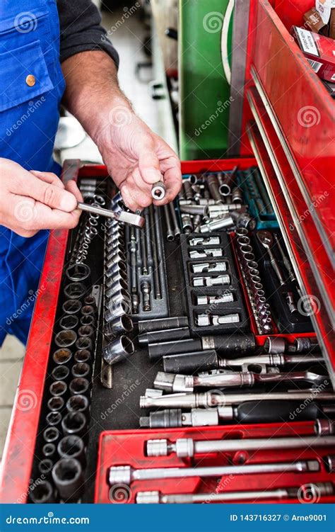 Auto Mechanic Holding Working Tools From Tool Box Stock Image Image