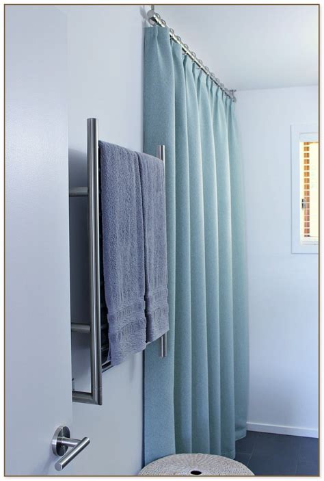 It also makes a small space look bigger. Ceiling Mounted Shower Curtain Rods