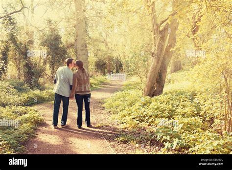 Couple Walking In The Park Stock Photo Alamy